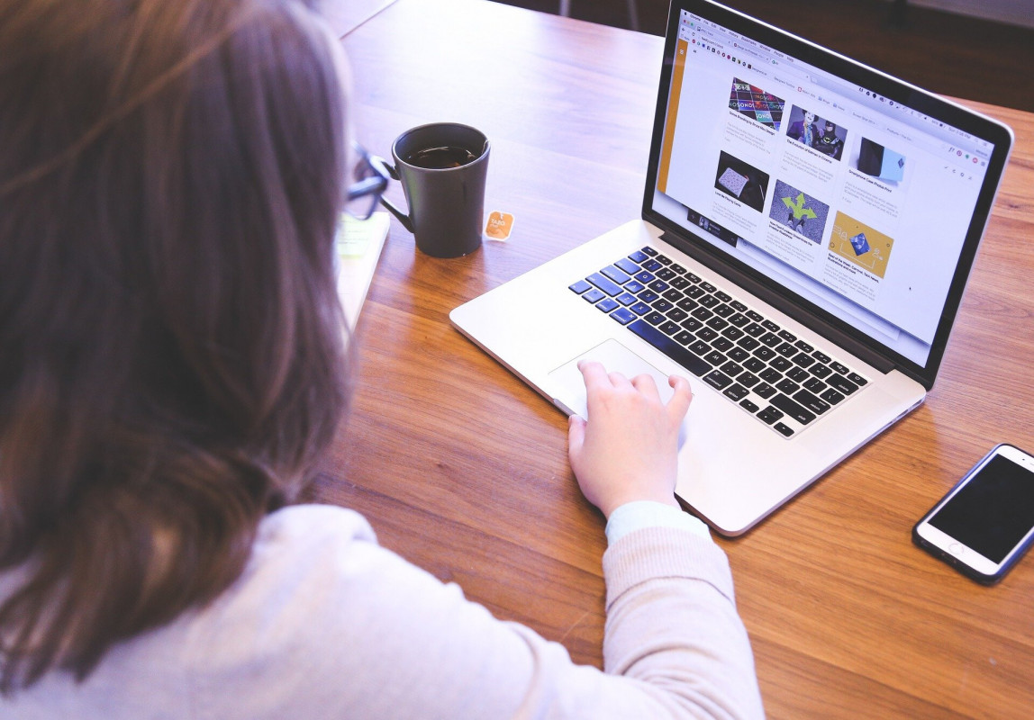 Woman sat at a laptop