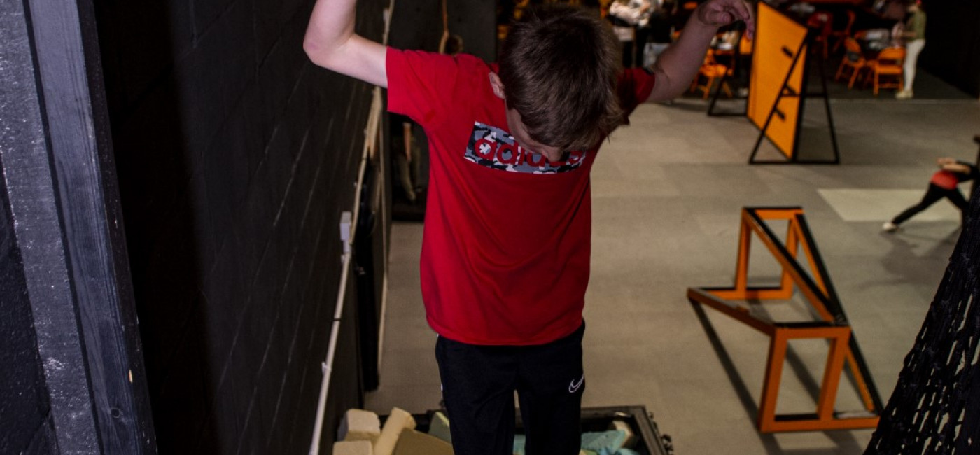 Child jumping into a foam pit at EGNI, Tredegar